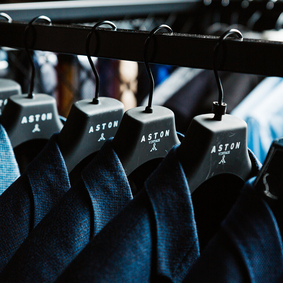 a wide range of high quality but cheap and affordable suit brands hanging in store