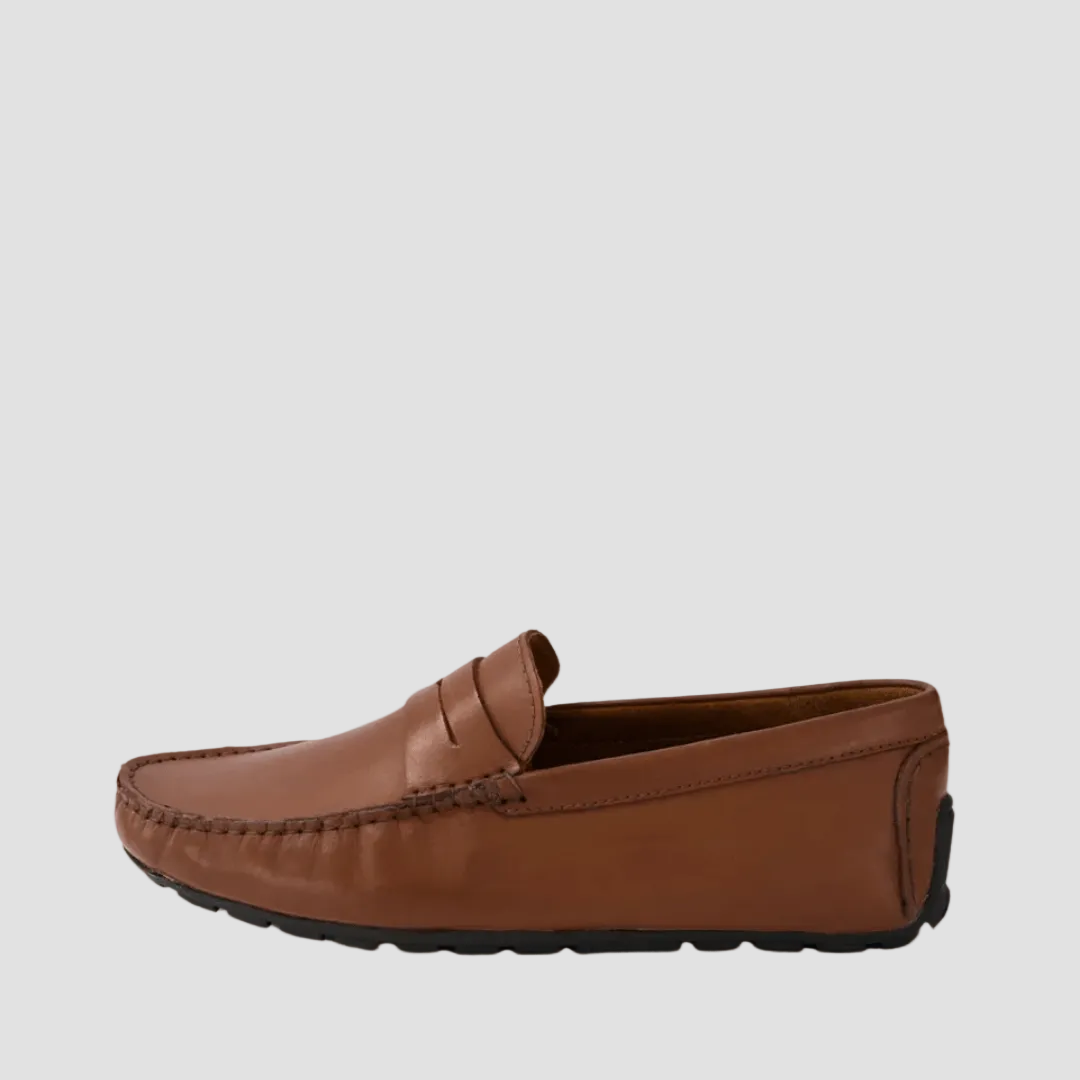 A brown leather loafer with a penny strap and round toe silhouette.