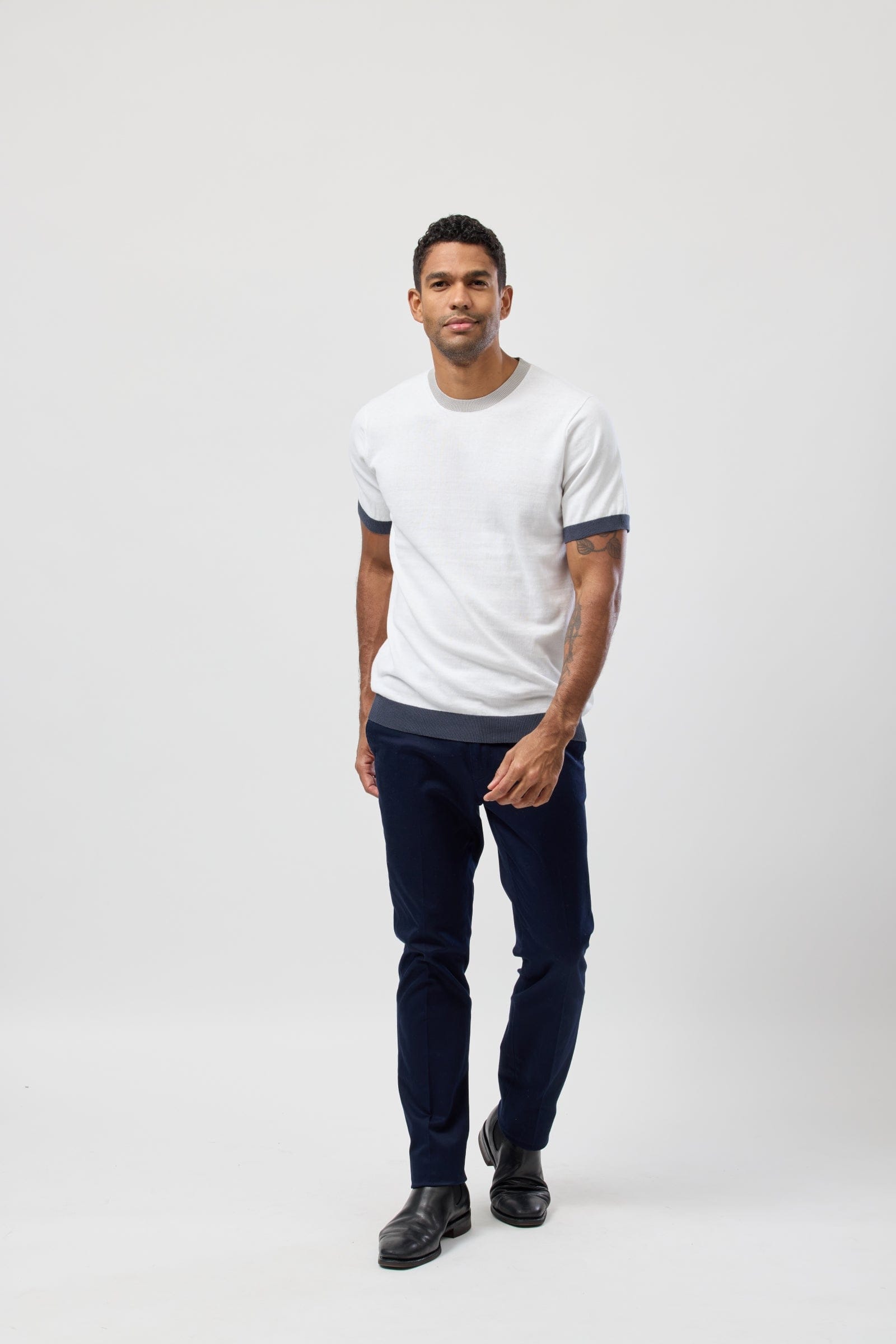 The Brooksfield Mens Cotton Crew Neck Knitted Tee in White paired with black pants
