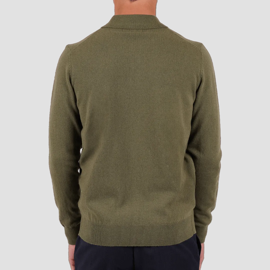 Green sweater worn by a person on a transparent background