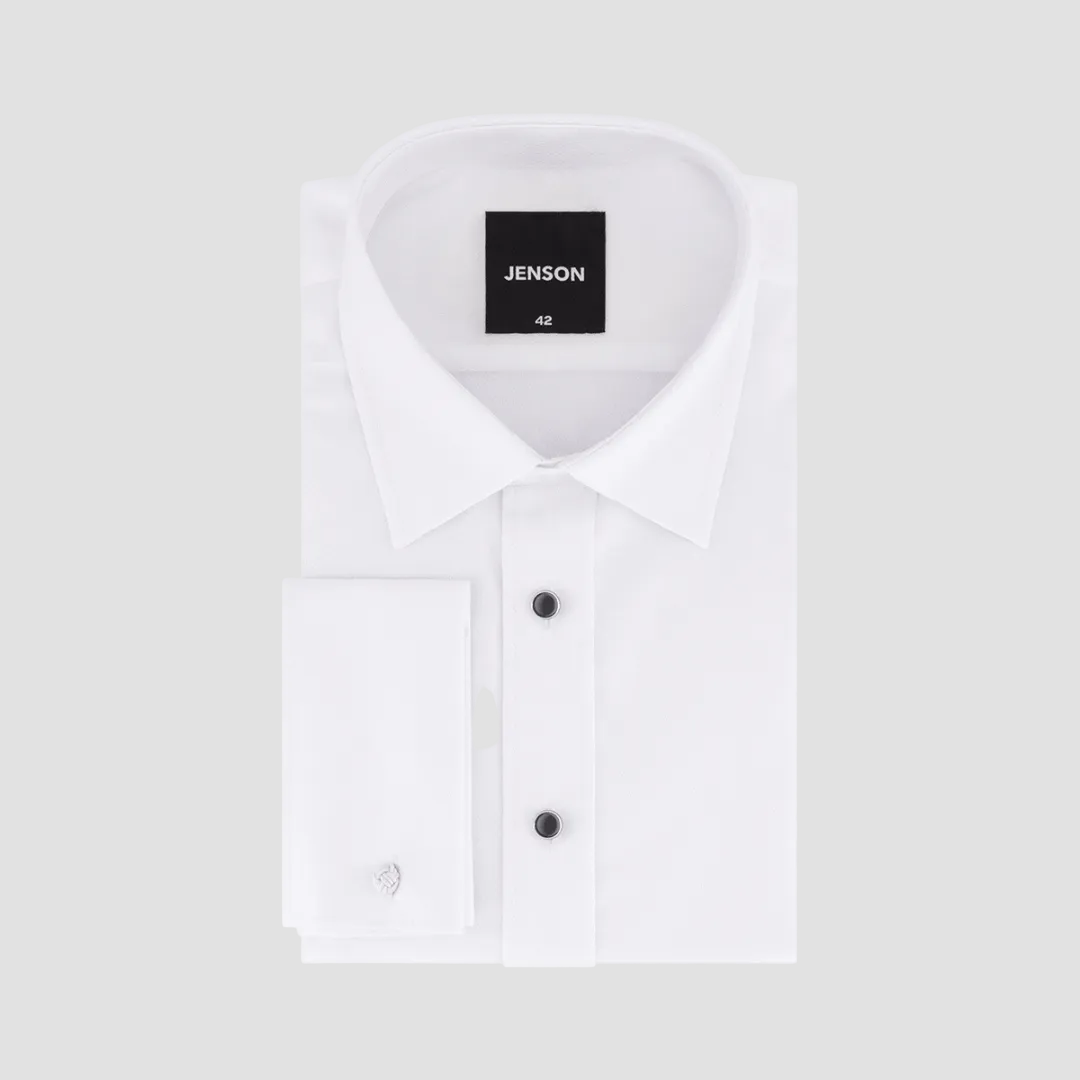 A white, textured, French cuff, tapered fit men's dress shirt with black contrast buttons.