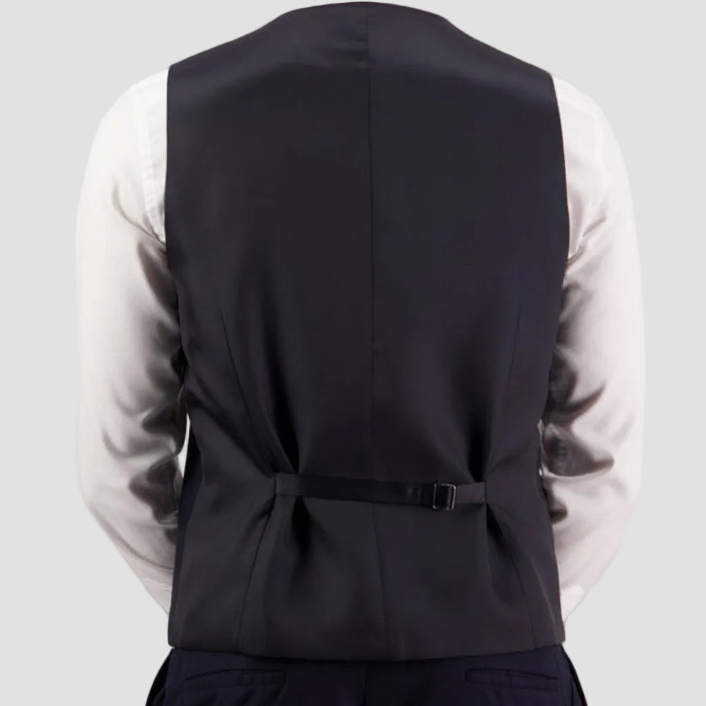 Black vest by Savile Row over a light-colored shirt