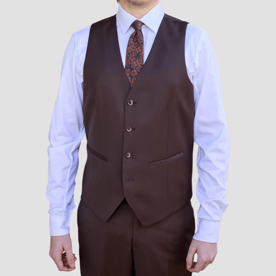 Brown suit vest by Savile Row worn over a white shirt with a patterned tie