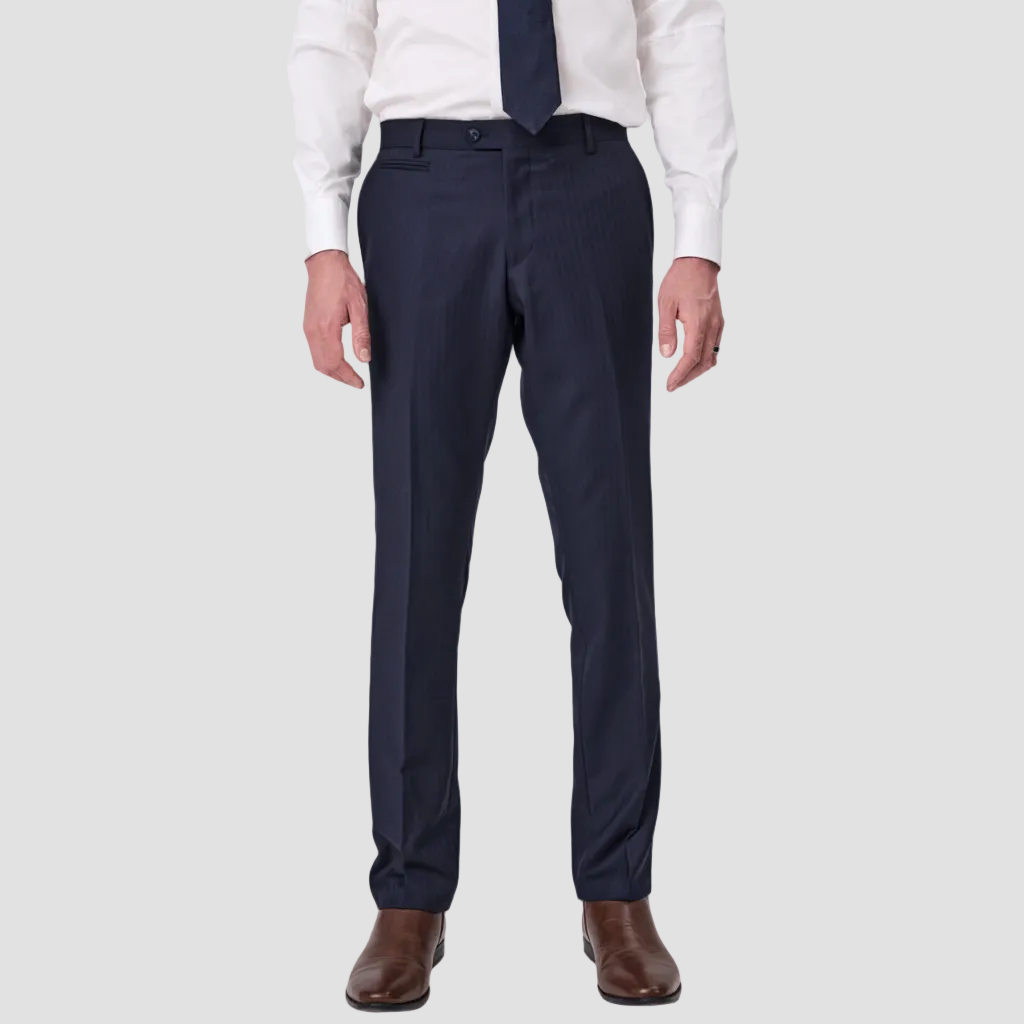 Navy Tasmanian wool dress pants by Savile Row worn with a white shirt and brown shoes.