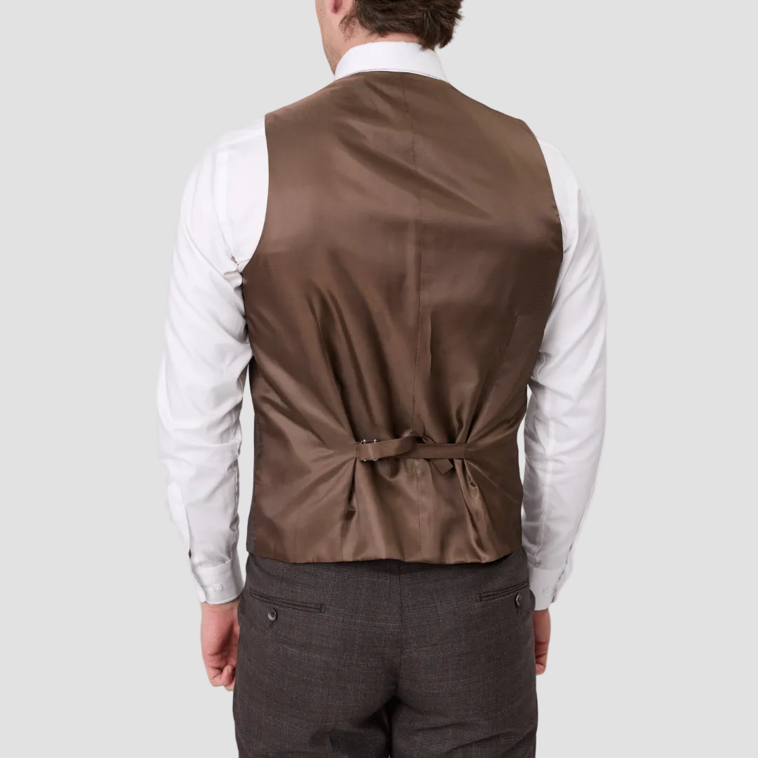 An Australian merino wool brown suit vest with a satin back and adjustable tab over a white shirt.