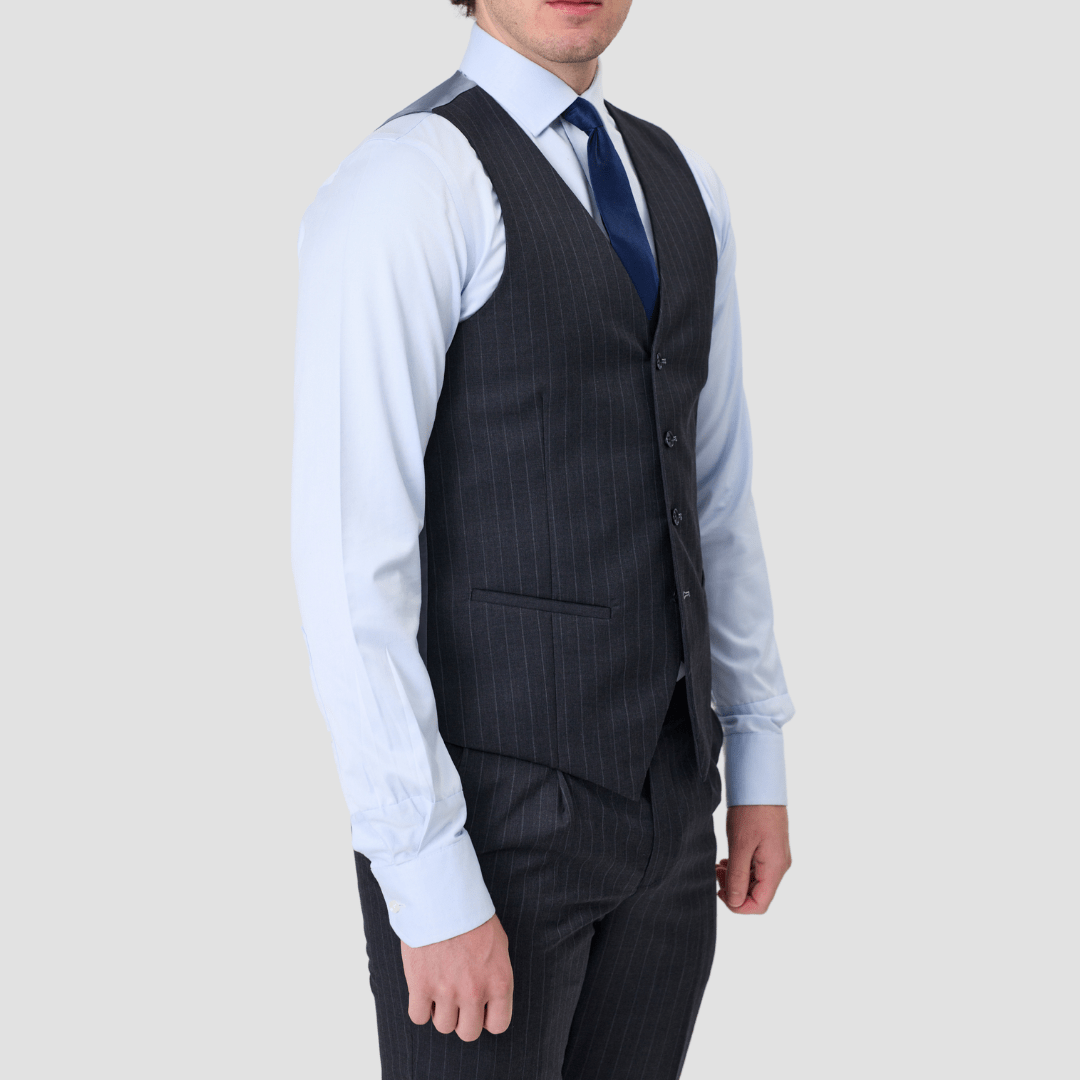 Charcoal pinstripe suit vest in Australian Merino Wool by Savile row with matching pants, a light blue shirt and royal blue tie.