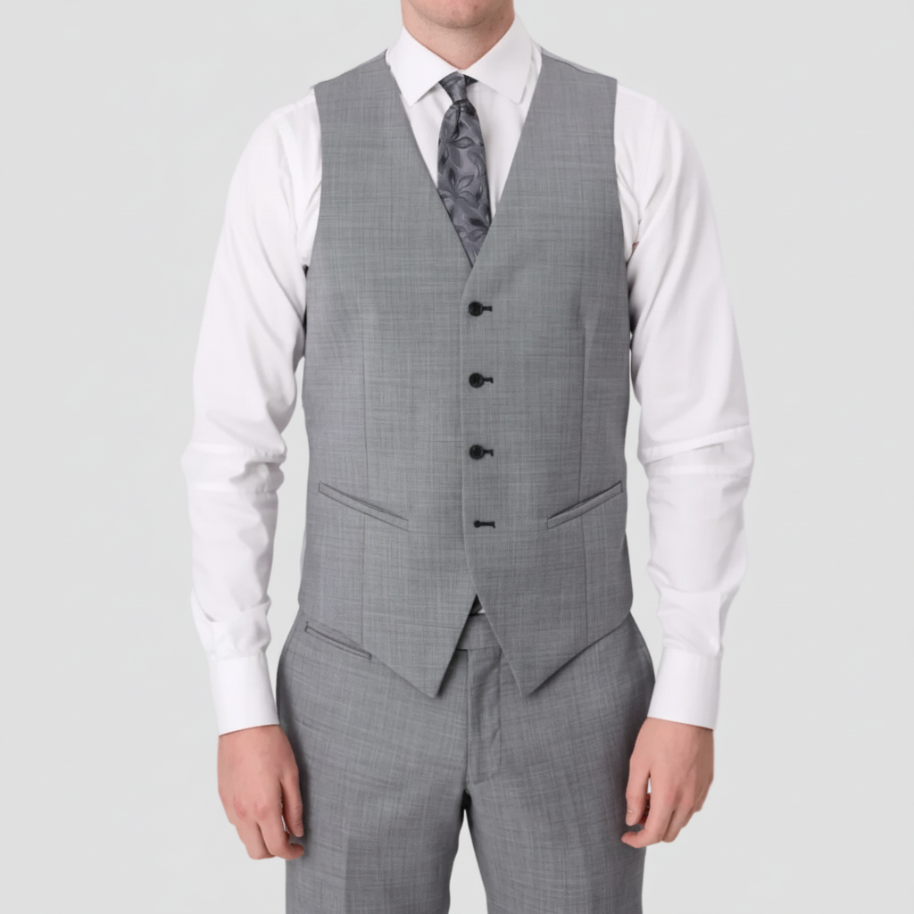 Chrome four buttoned textured vest with pockets by Savile Row with matching pants, white shirt and grey patterned tie.