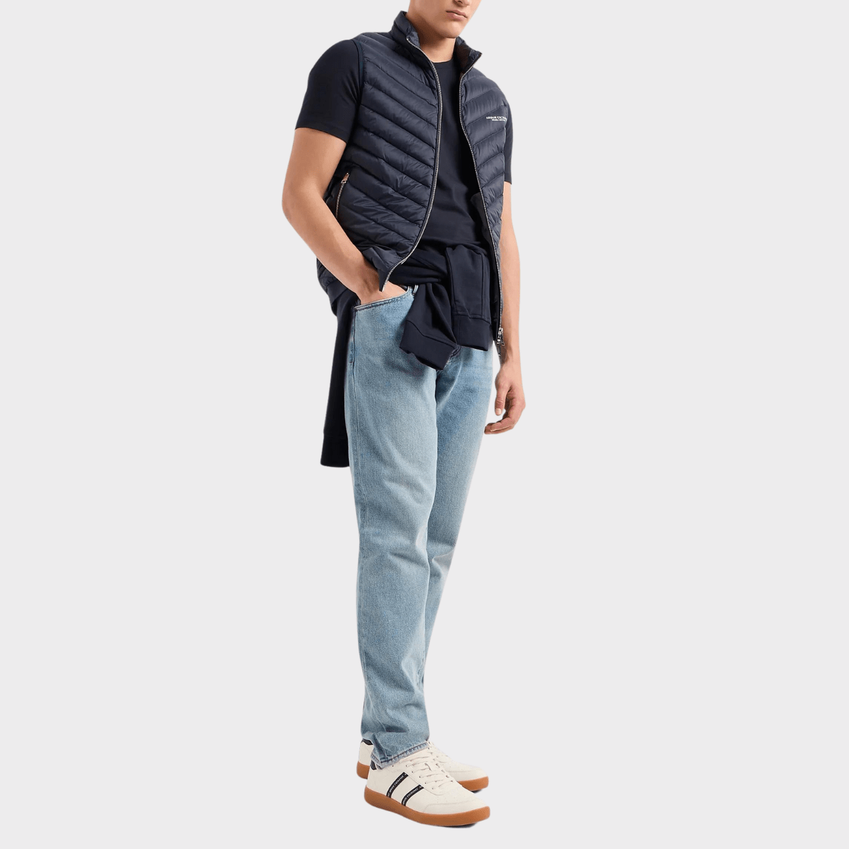 Pairing the navy blue Armani crew shirt with a bomber vest.
