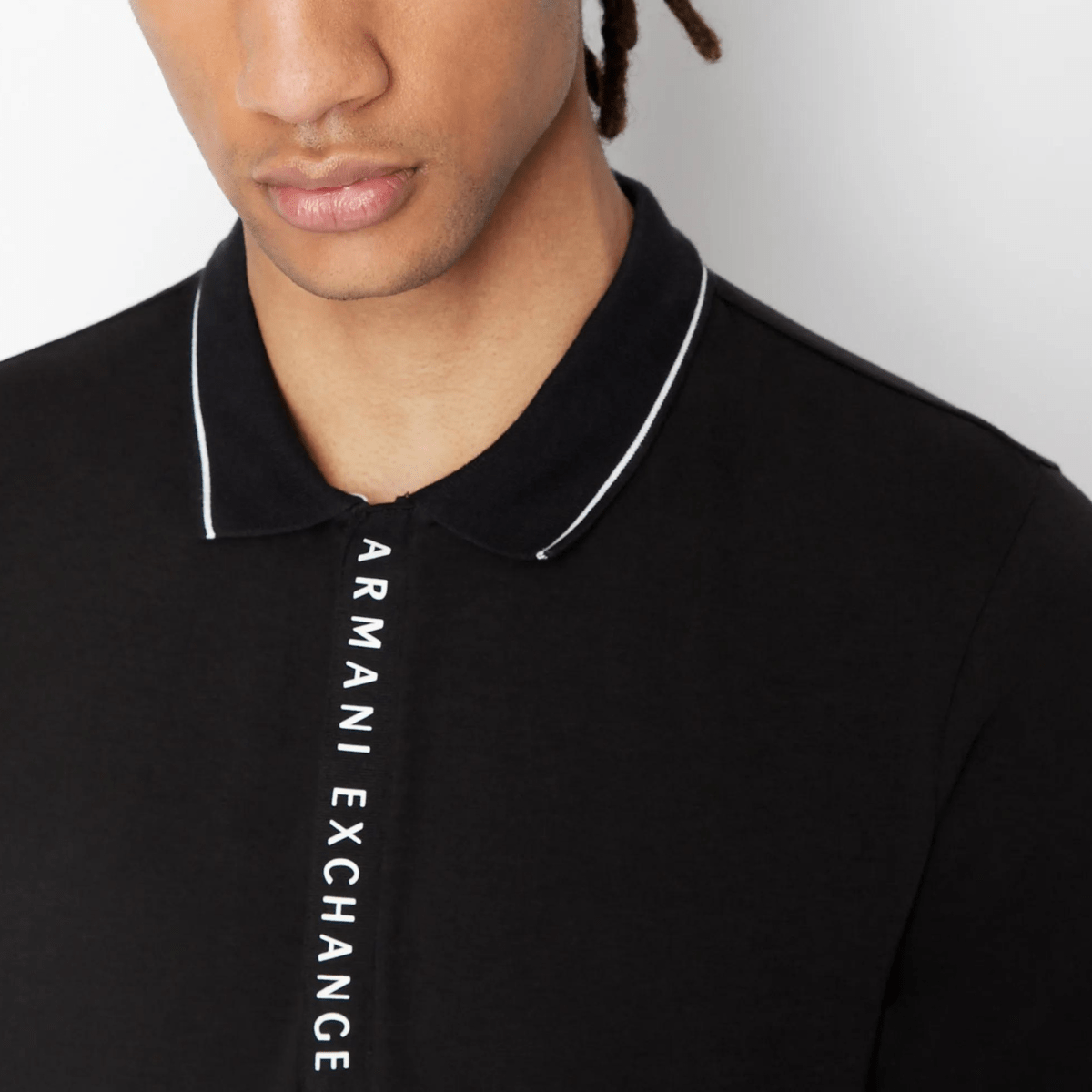 Collar detail with logo of the black polo shirt by Armani