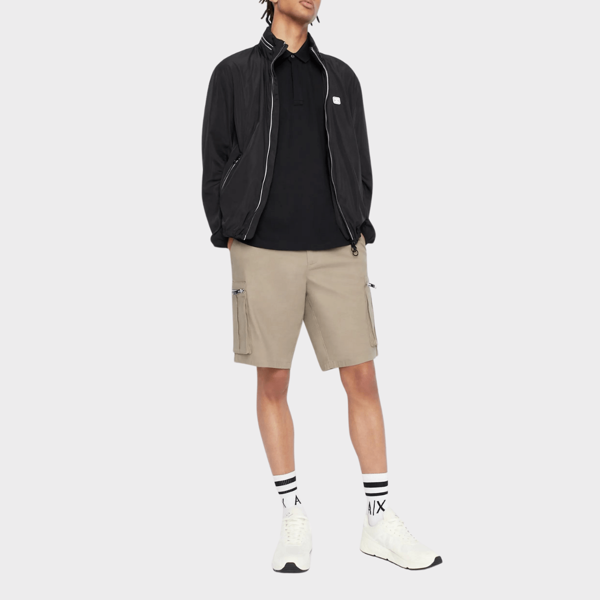 Styling the zip neck polo in black with cargo pants and jacket