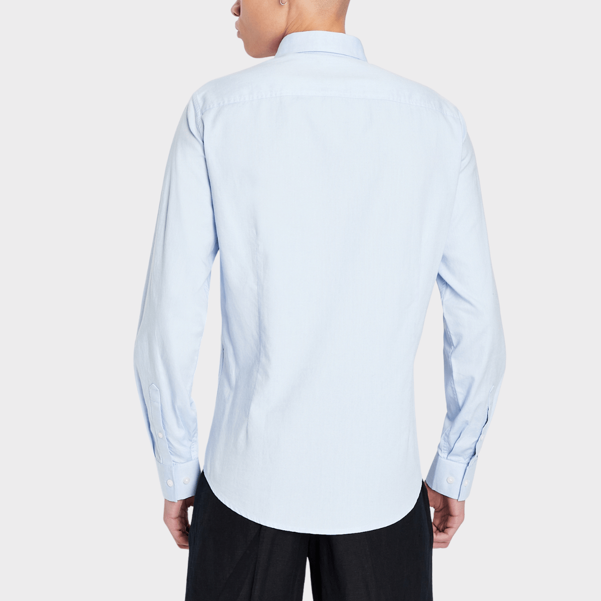The back view of the fitted oxford Armani business shirt in light blue