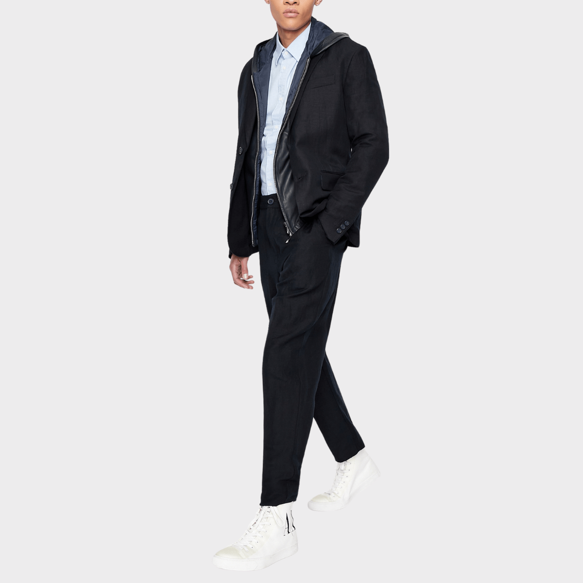 The slim fit oxford business shirt in light blue by Armani paired with a jacket.