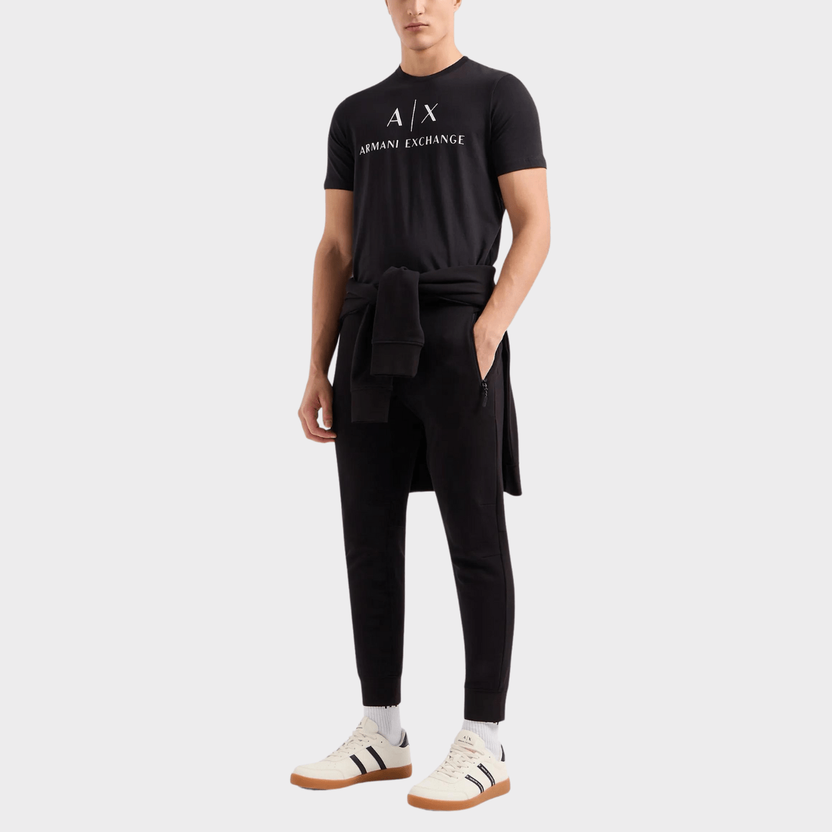 Styling the fitted Armani men's shirt in black with a tracksuit