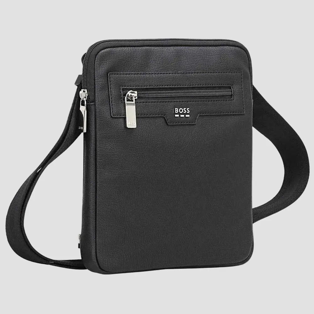 A black textured leather crossbody bag with a front zippered pocket featuring a silver-tone BOSS logo plaque, shown on a plain white background.