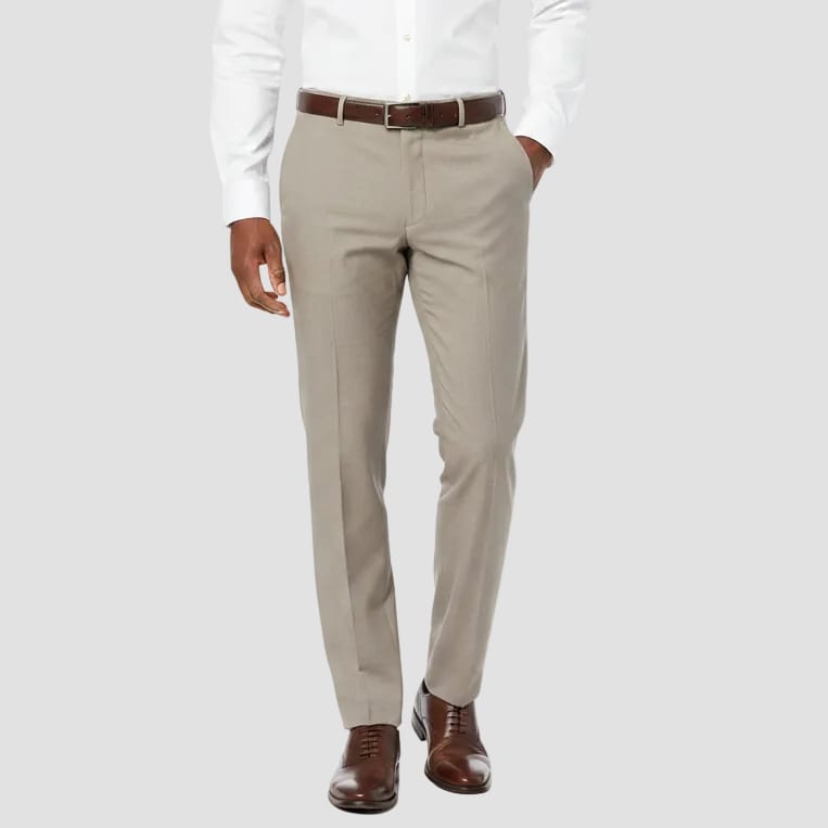 Beige dress pants on a white background