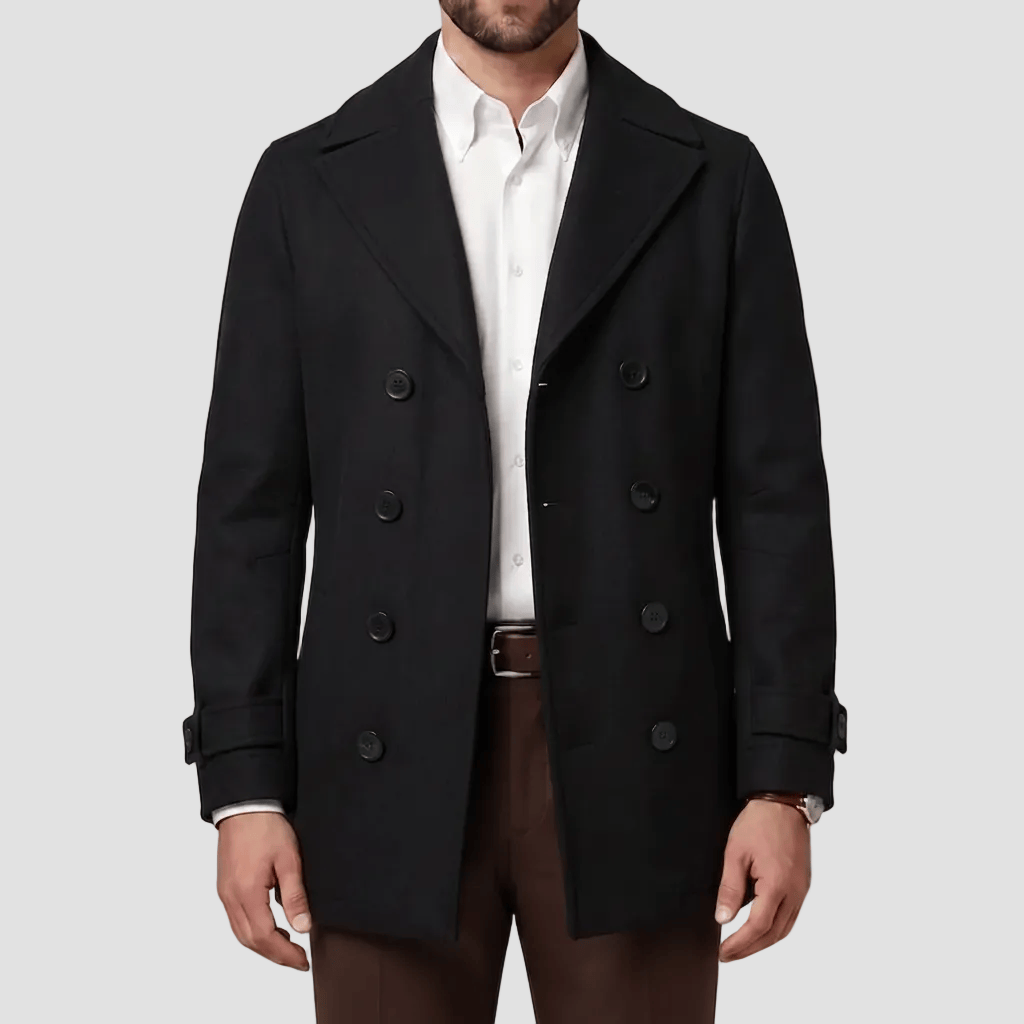 Boston’s Peabody black coat in a refined double‑breasted silhouette with strapped cuffs, back belt and oversized lapels.