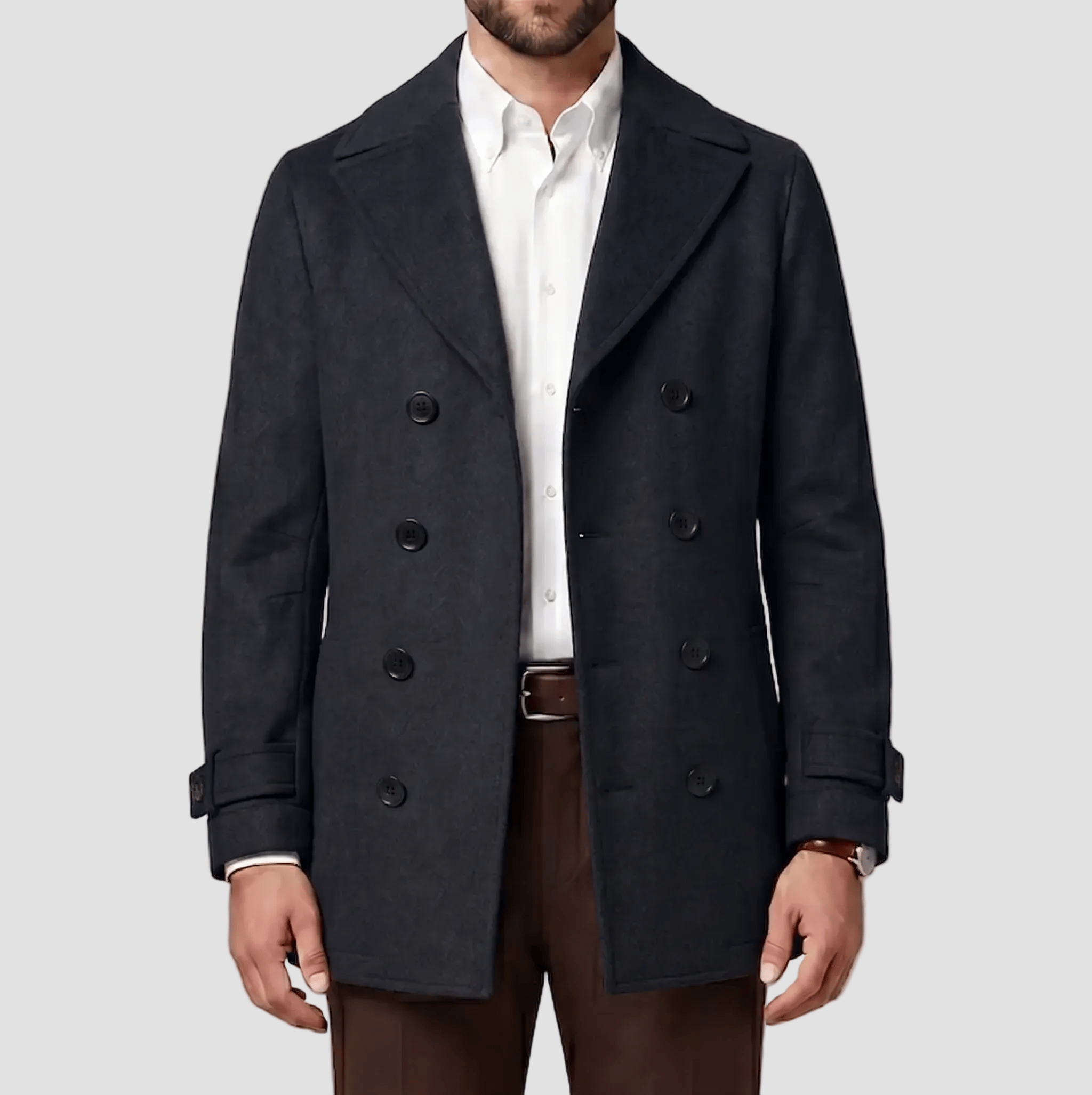 Boston’s Peabody navy coat in a refined double‑breasted silhouette with strapped cuffs, back belt and oversized lapels.