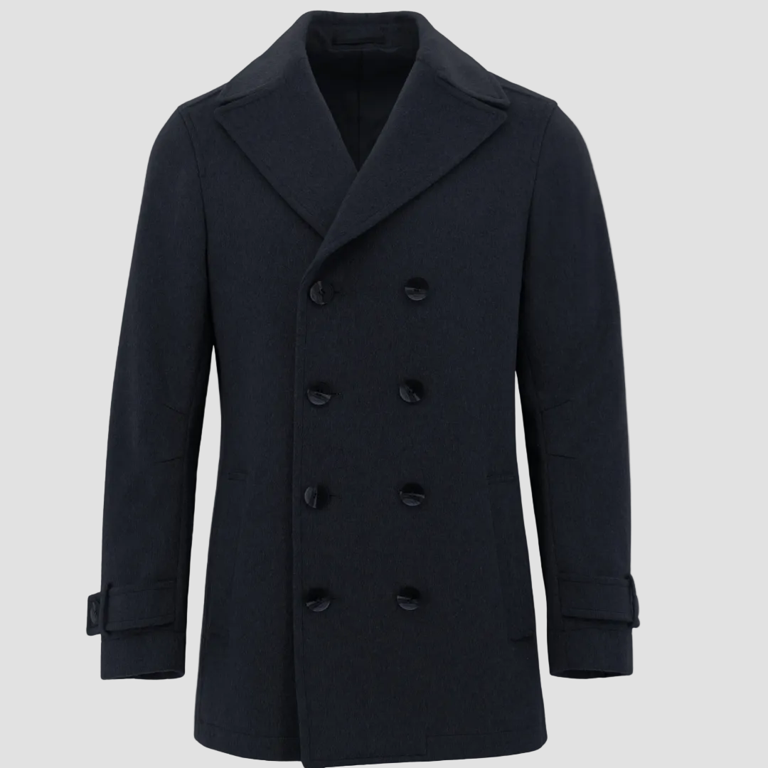 Boston’s Peabody navy coat in a refined double‑breasted silhouette with strapped cuffs, back belt and oversized lapels.