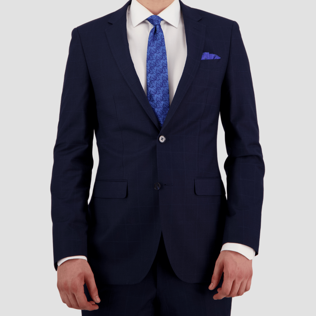 Bruton’s Abram Cornerstone Navy Suit—slim fit jacket and Jesse trouser in check fabric.