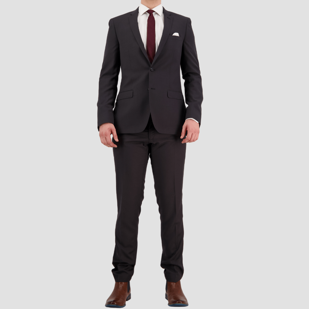 Bruton’s David Keystone slim‑fit charcoal suit with performance finish.