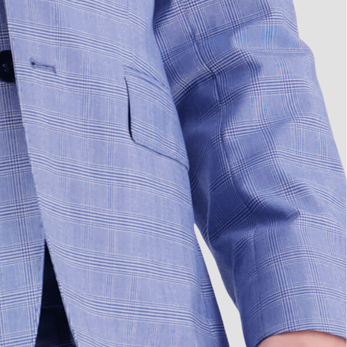 Bruton’s Jed Jadestone Sky Suit—slim fit with peak lapel, sharp tailoring and a polished performance finish.