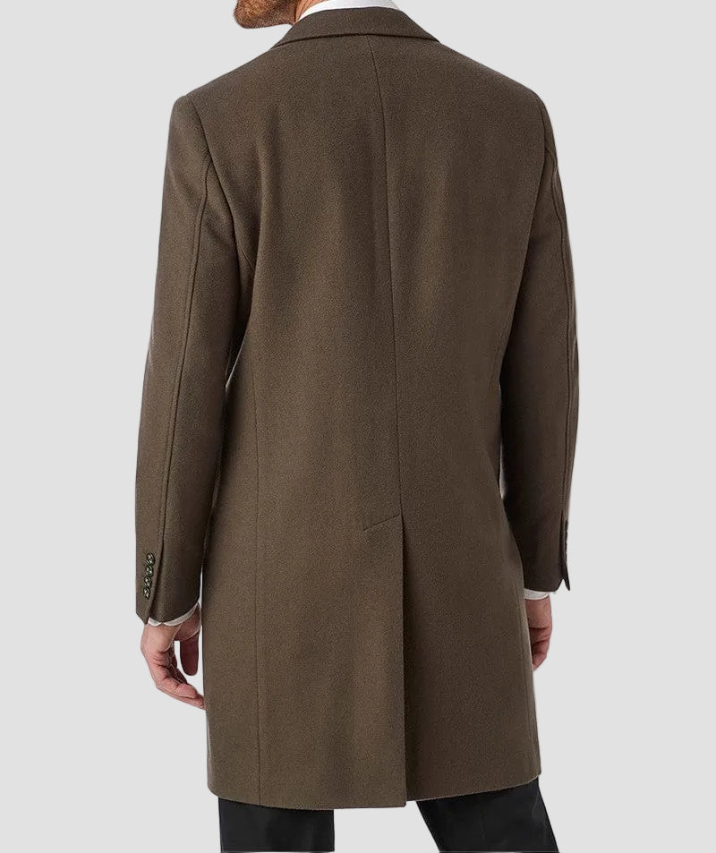 Man wearing a brown overcoat on a white background