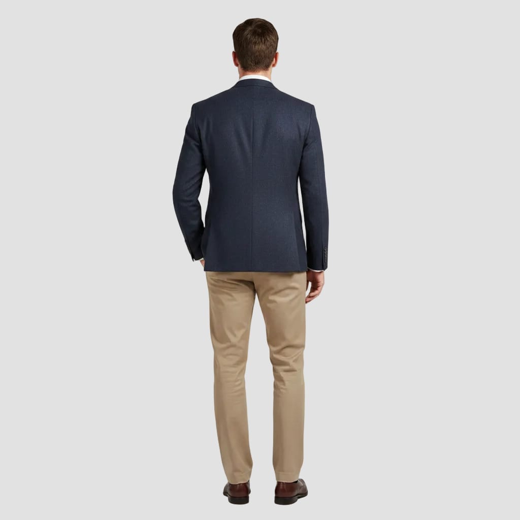 Back view of a gray suit jacket on a white background