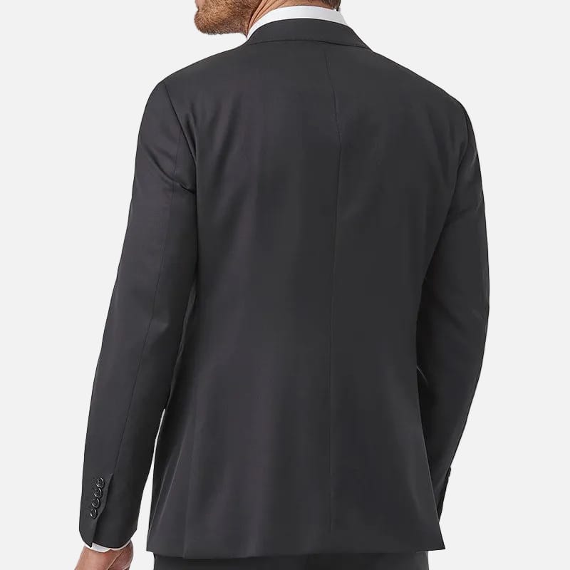A man wearing a black suit jacket and matching trousers, shown from the back against a plain white background.