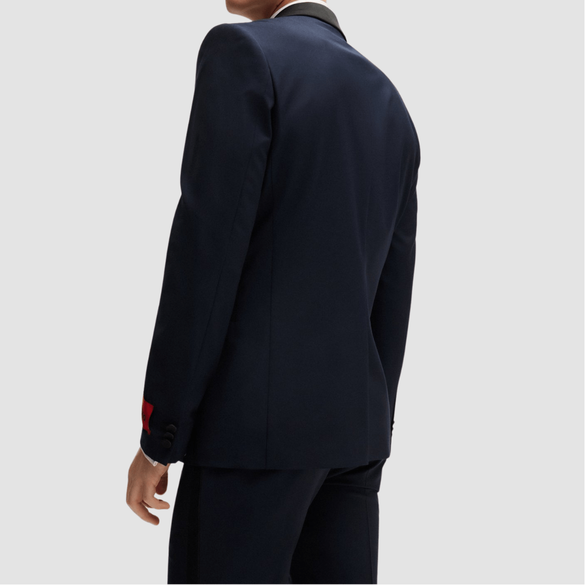 The Arti‑Getlin dark blue tuxedo by Hugo—super slim fit with black satin trims and shawl lapel.