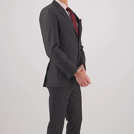 Video of a tailored charcoal textured suit in Super 110’s Merino by Savile Row for comfort and polish.