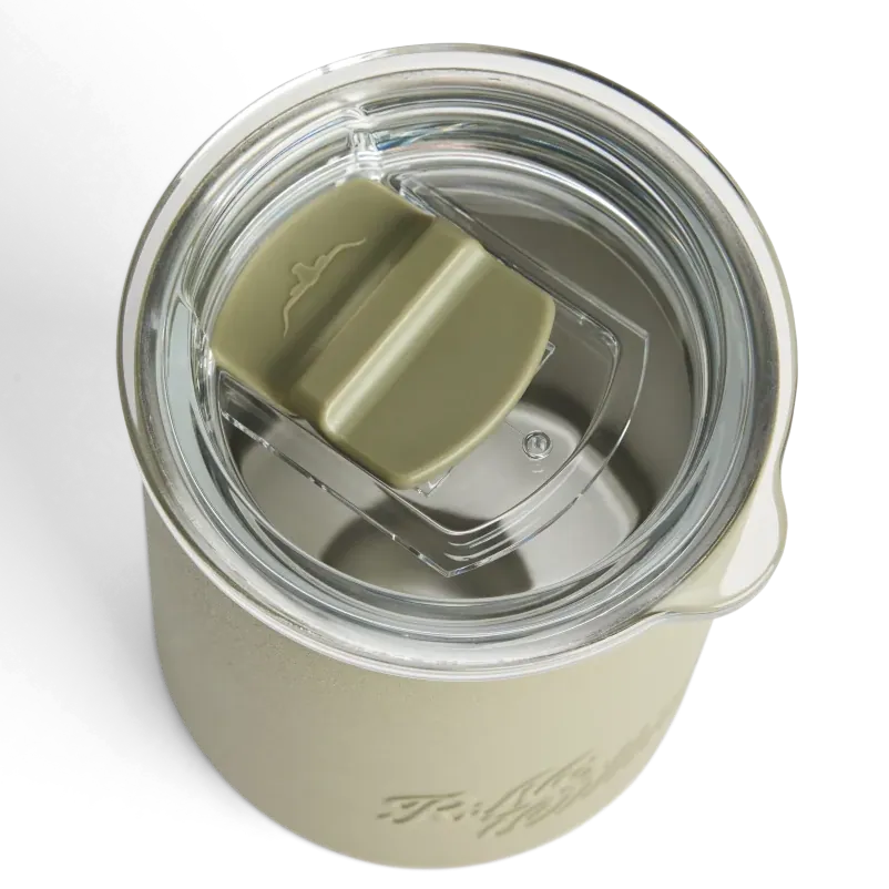 Top-down view of a beige insulated tumbler with a clear lid and an olive green flip spout, on a white background.