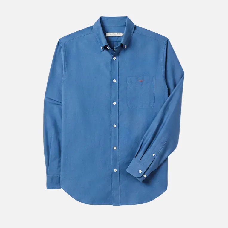 A blue long-sleeve button-down shirt with a chest pocket and white buttons, shown on a plain white background.