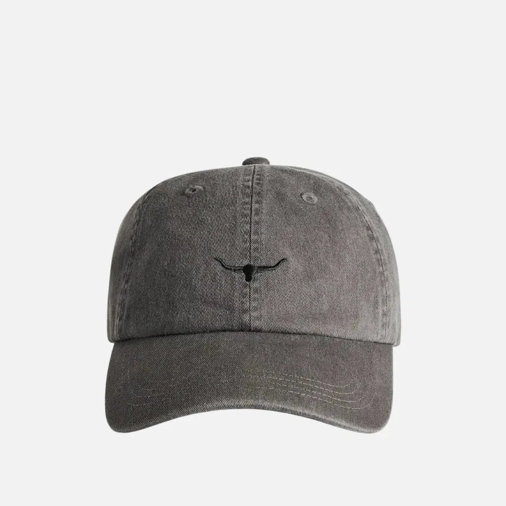 A washed dark gray baseball cap with a small black embroidered longhorn logo on the front, shown against a plain white background.