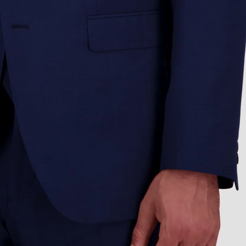 A close up of a textured denim blue fabric, from a tailored fit men's suit from Savile Row.