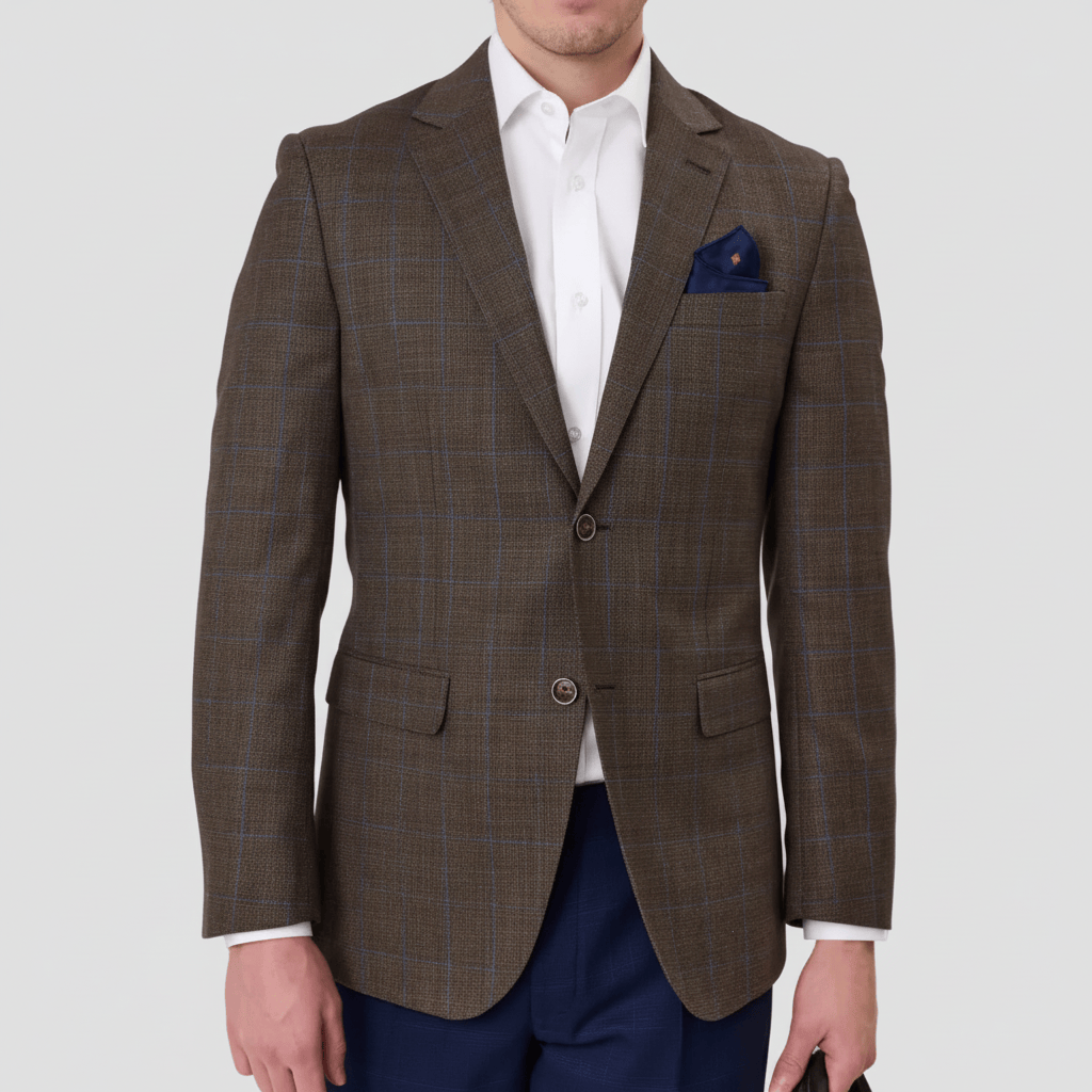 Brown checkered sports jacket by Savile Row with a blue pocket square and white shirt.