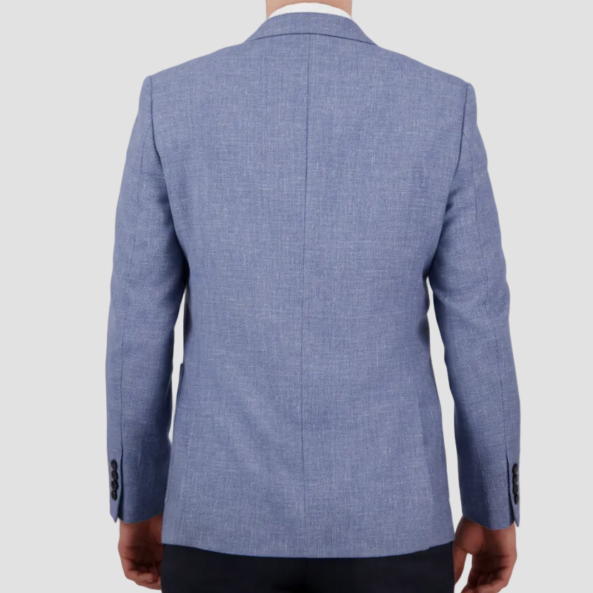 A man wearing a sky blue sports jacket by Savile Row paired with dark trousers.