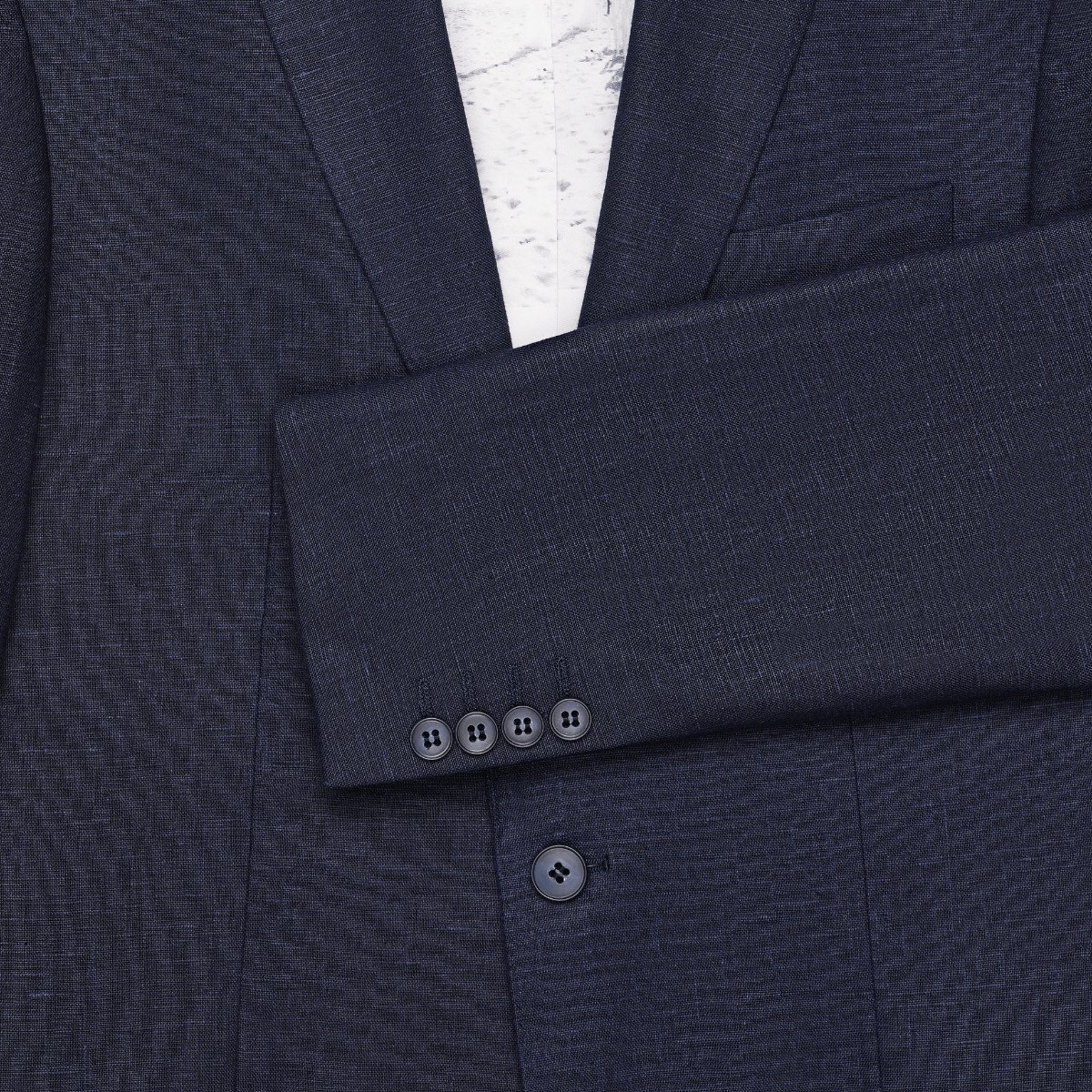 Mens single breasted pure linen navy suit by Savile Row with four buttons on the sleeve.