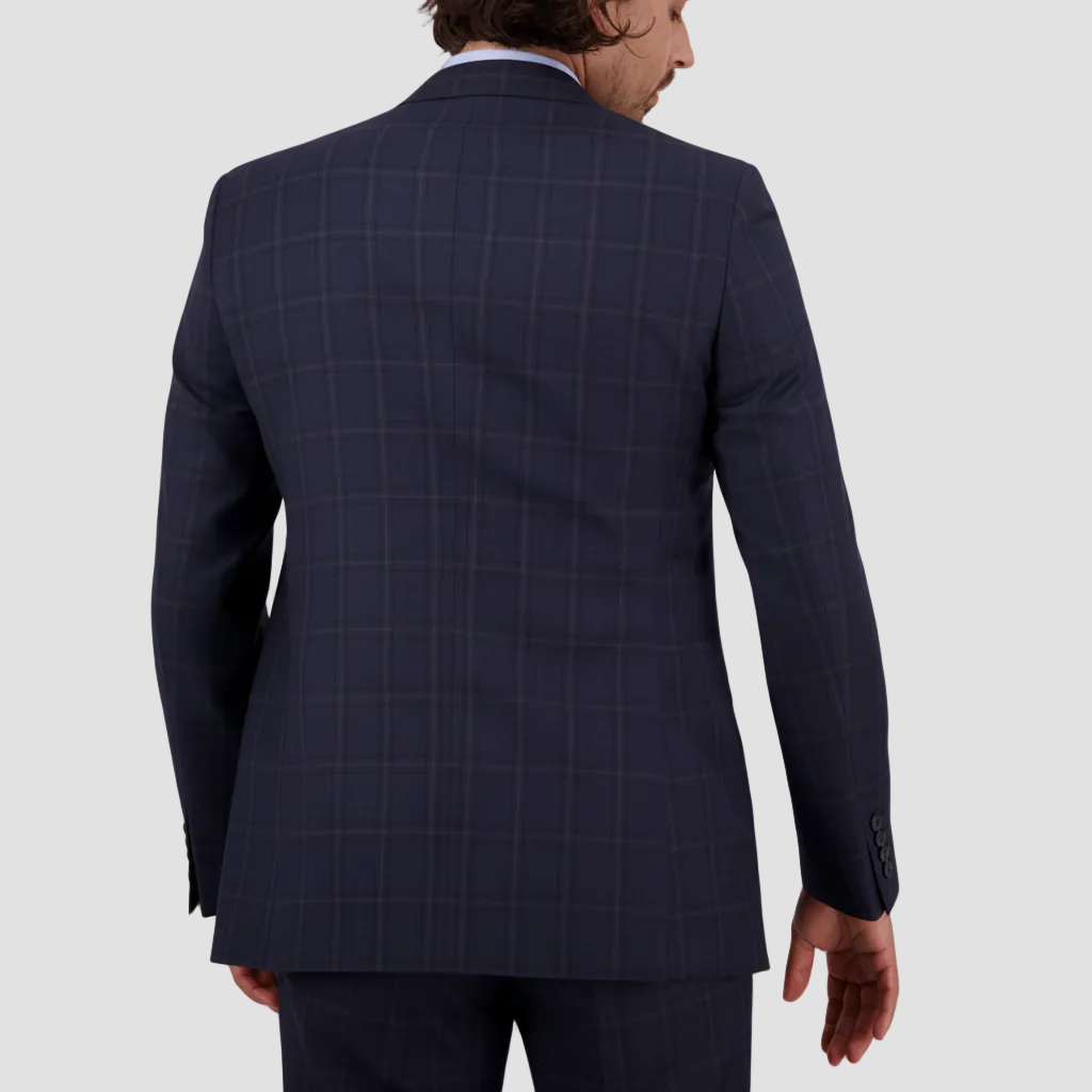 Super 120’s Merino Wool and a tailored silhouette define the midnight check Abram Suit.