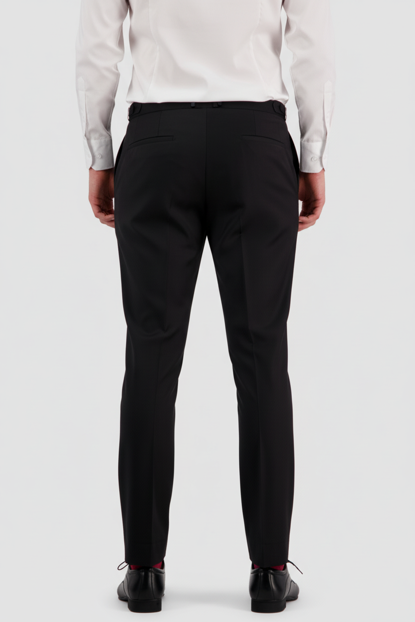 A man wearing Savile Row slim-fit Jotham black pants and a white shirt.