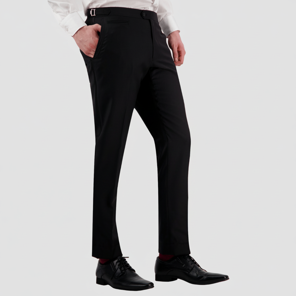 A man wearing Savile Row slim-fit Jotham black dress pants.