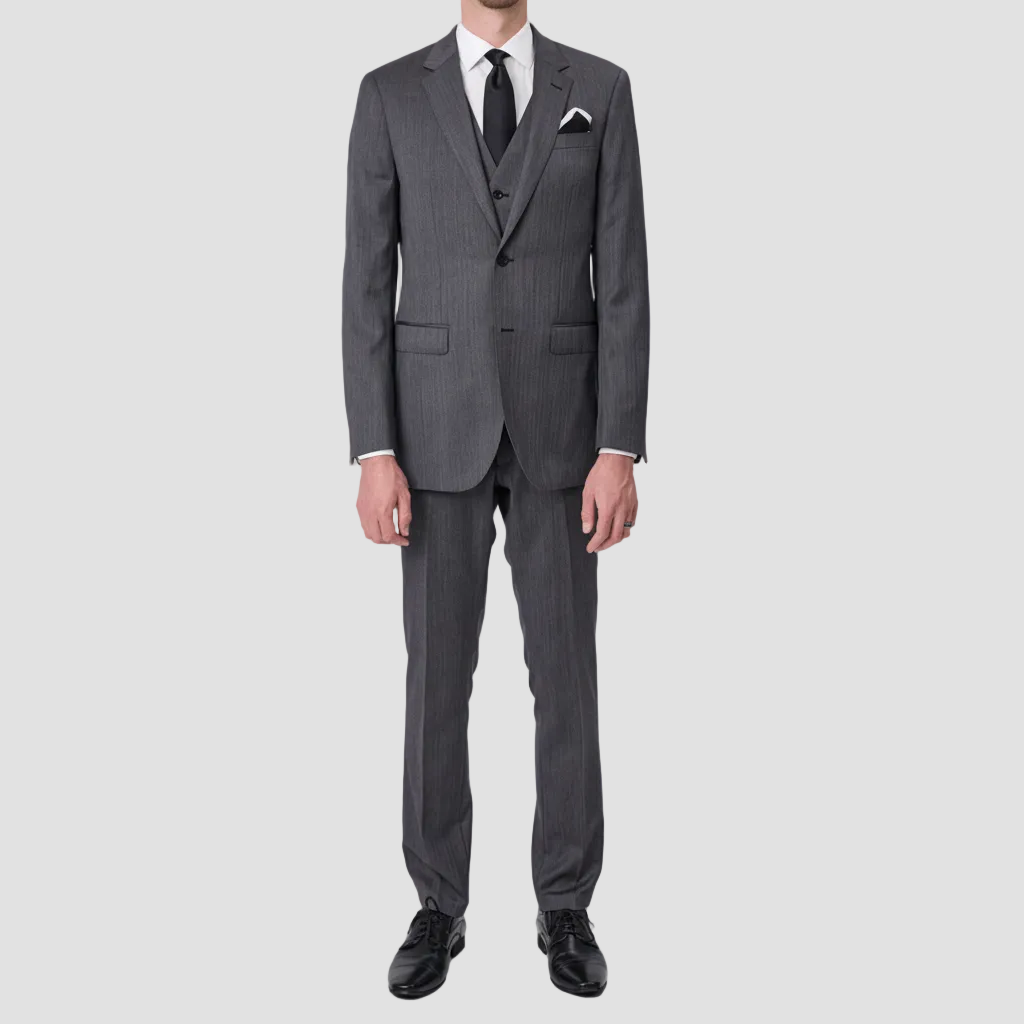 Gray suit in 100% Tasmanian Wool by Savile Row, with white shirt, black tie, black and white pocket square and black leather shoes.