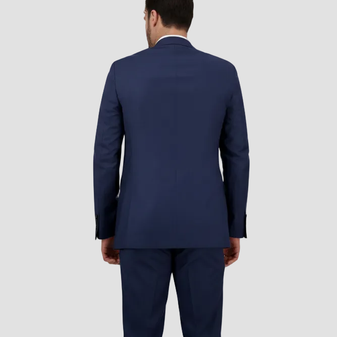 The back of a navy blue tailored Savile Row suit jacket and pants