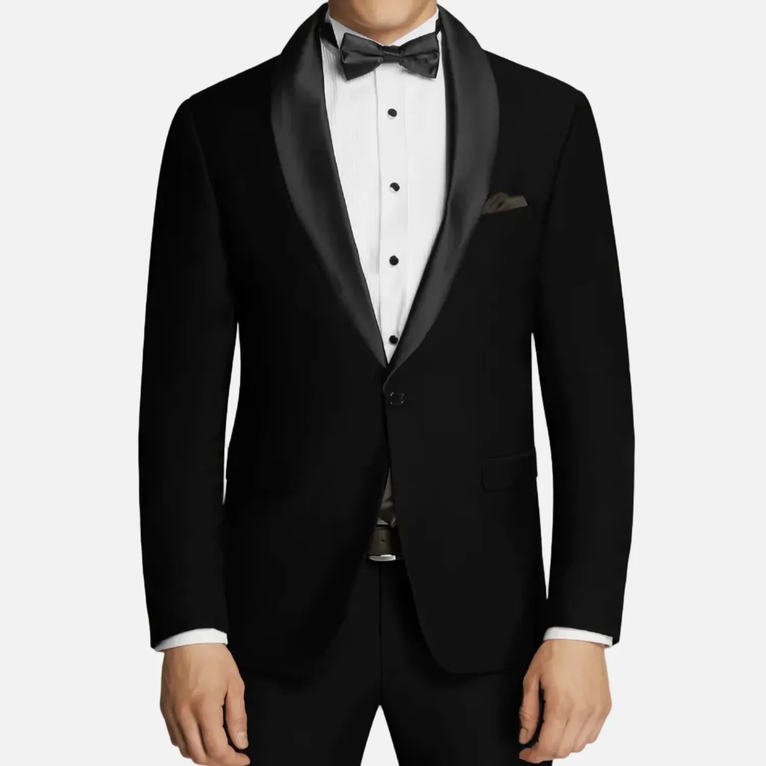 A man modeling a black tuxedo jacket with black satin shawl lapels, worn over a white tuxedo shirt with a black bow tie and pocket square, against a light gray studio background.