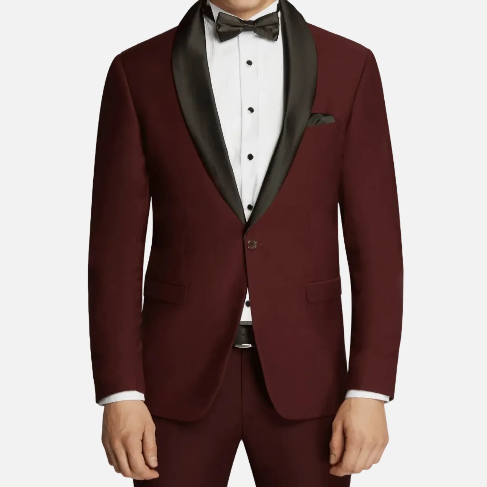 Man wearing a burgundy tuxedo with black lapels on a plain background