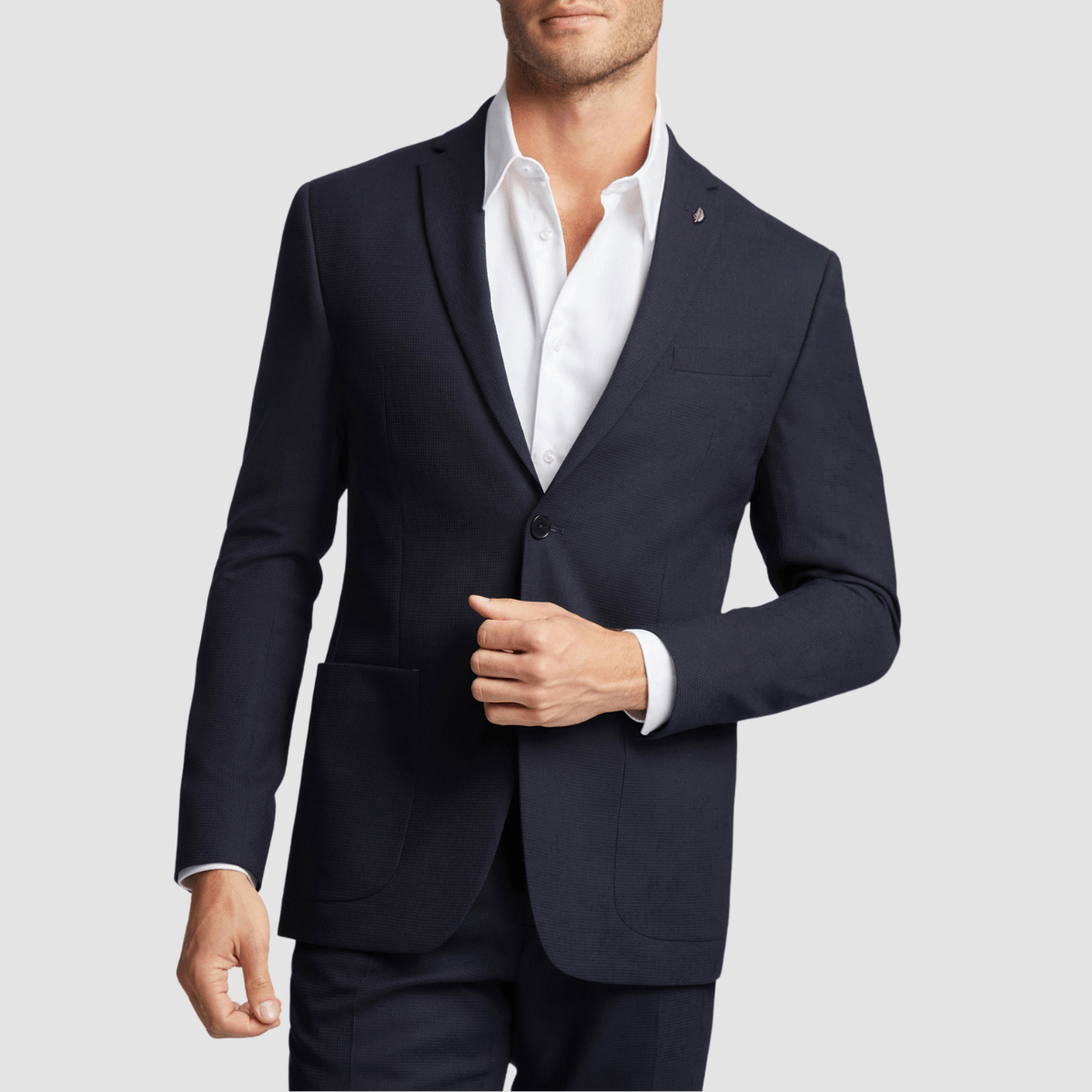 The Mens Slim Fit Kepler Suit in Navy paired with white men's polo