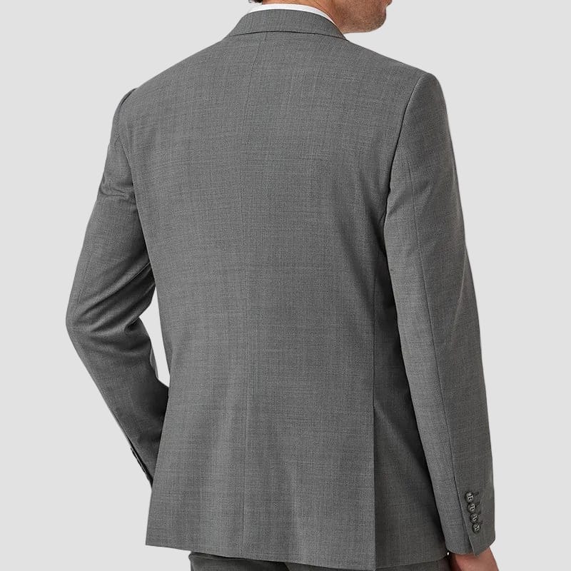 Man wearing a gray suit jacket on a white background