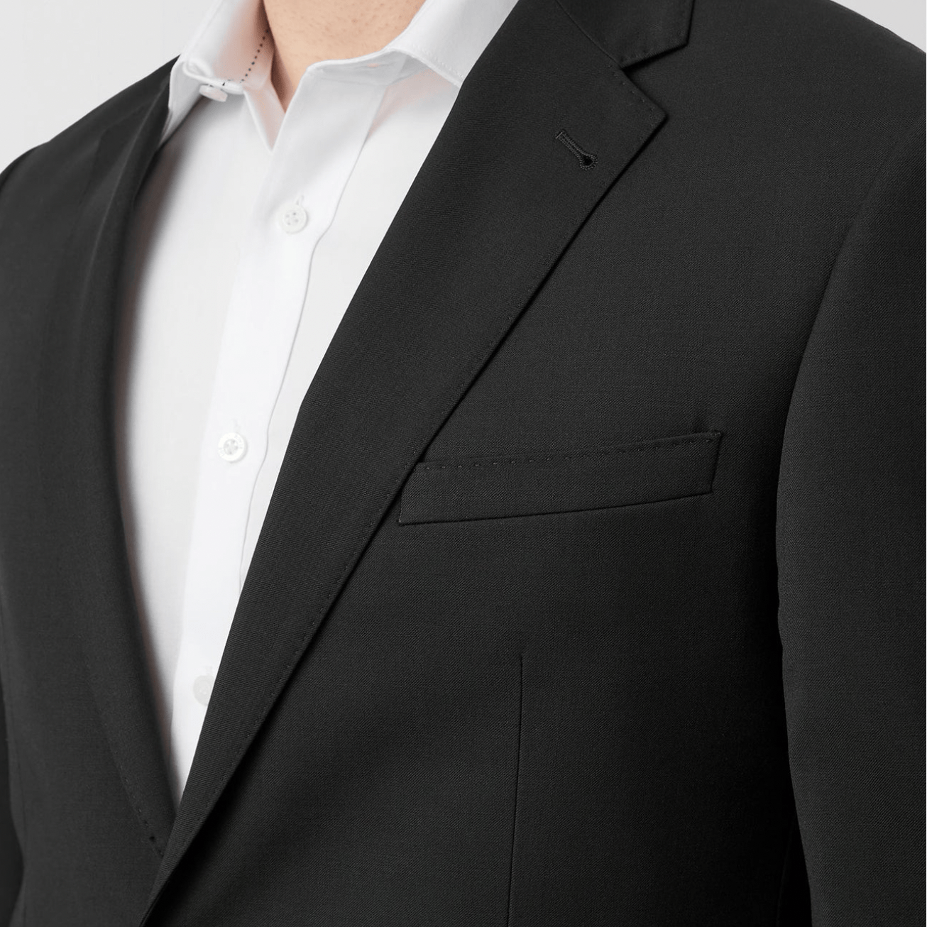 Wool Blend black suit jacket by Uberstone with white shirt.