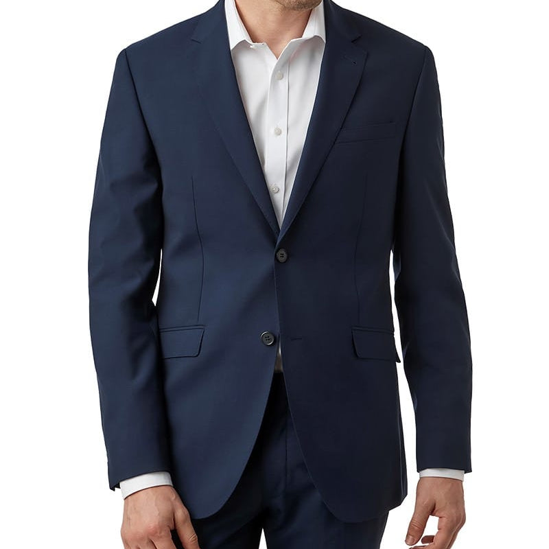 Man wearing a navy blue suit jacket over a white shirt on a white background