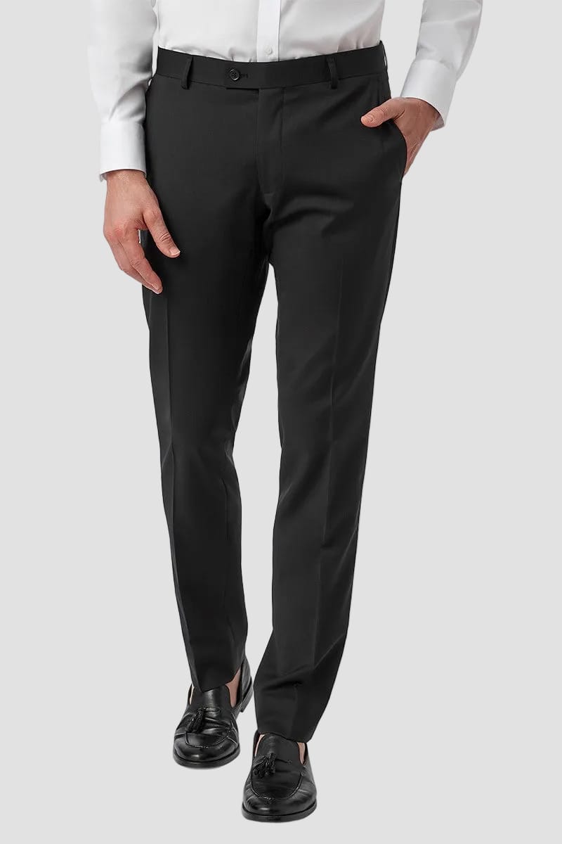 Person wearing black dress pants with a white shirt on a white background