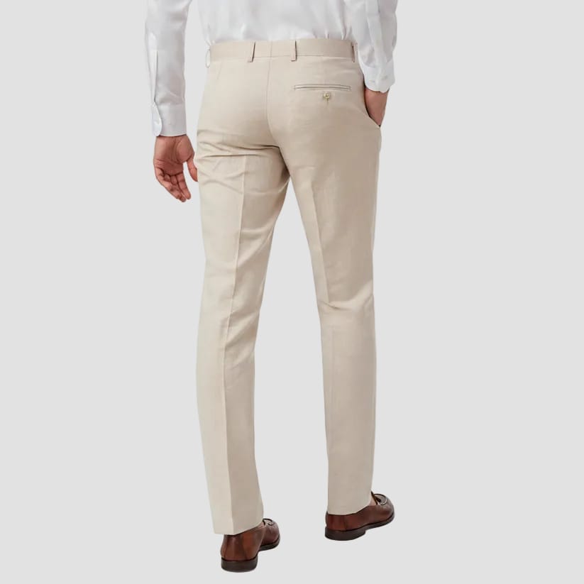 Beige dress pants worn by a person on a white background